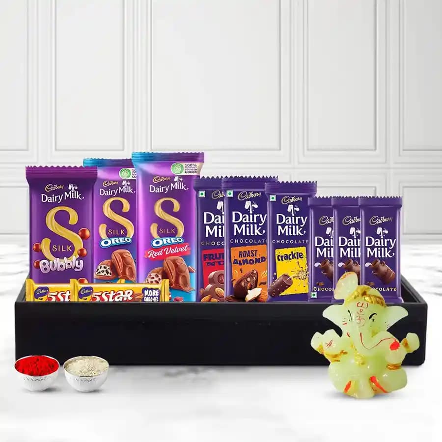 Dreamy Cadbury Delight Gift Basket with Glowing Ganesha N Roil Chawal