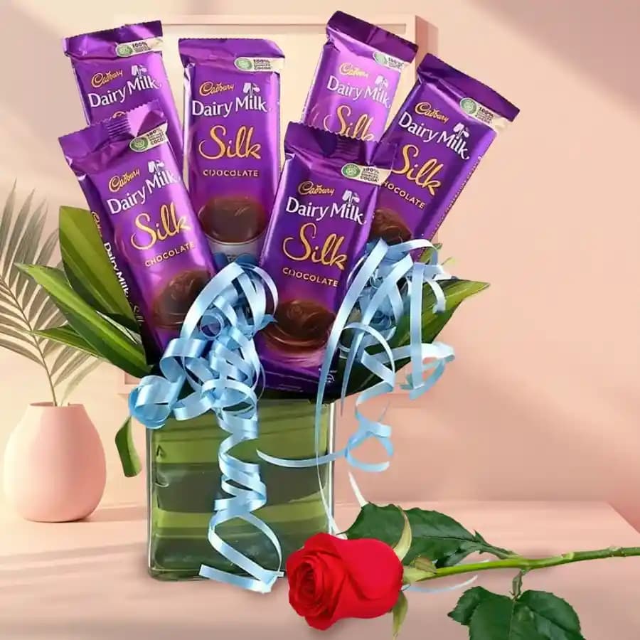 Appetizing Cadbury Dairy Milk Silk Arrangement in Glass Vase with Single Rose