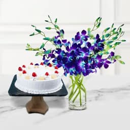 Blossoming Blue Orchids in Vase with White Forest Cake 1