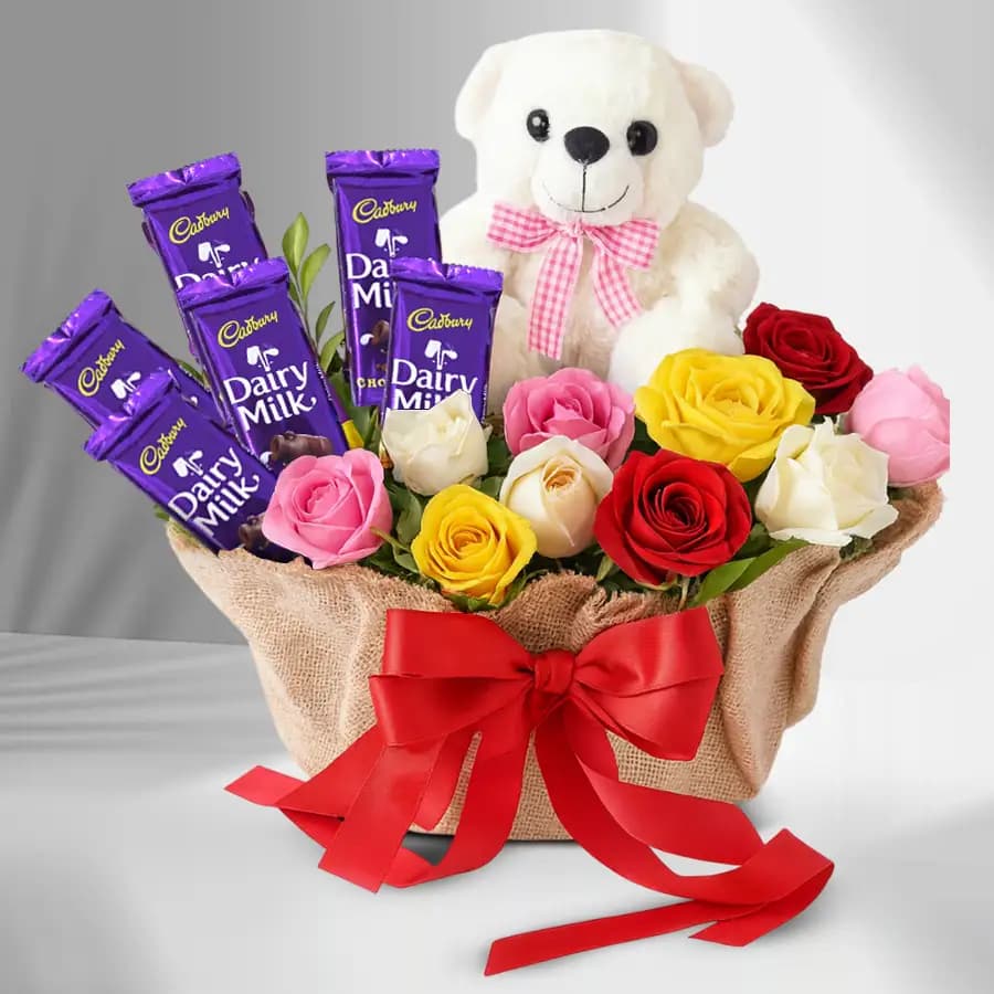 Gorgeous Display of Mixed Roses n Cadbury Dairy Milk with Teddy in Basket