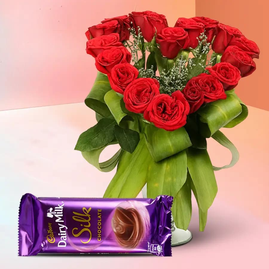 Spectacular Display of Heart Shape Red Roses in Vase with Cadbury Silk