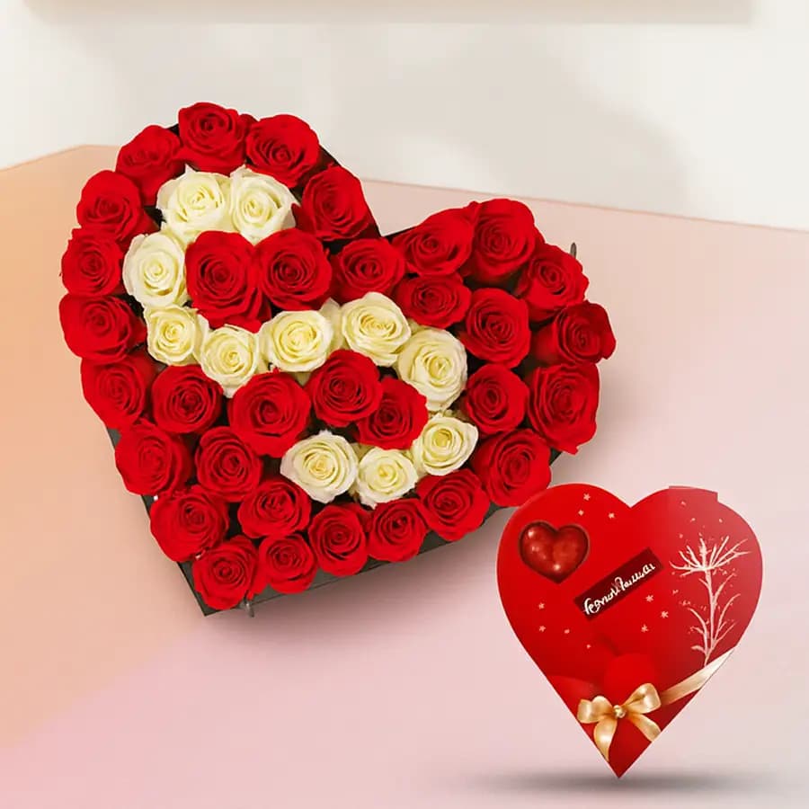Hearty Arrangement of Red n White Roses with Heart Shape Handmade Chocolates Box