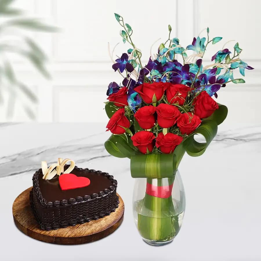 Hearty Red Roses n Blue Orchids in Vase with Heart Shape Choco Cake