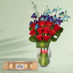 Enigmatic Red Roses n Blue Orchids in a Glass Vase with Ferrero Rocher Chocolates 1