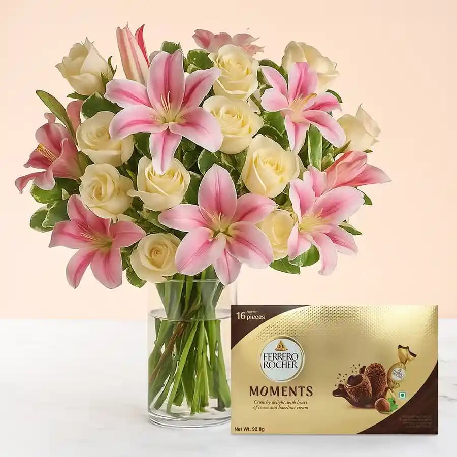Marvelous Lilies n Roses in Glass Vase with Ferrero Rocher Moments
