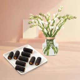 Kaju Choco Roll from Shree Mithai with Rajnigandha Stems in a Glass Vase 1