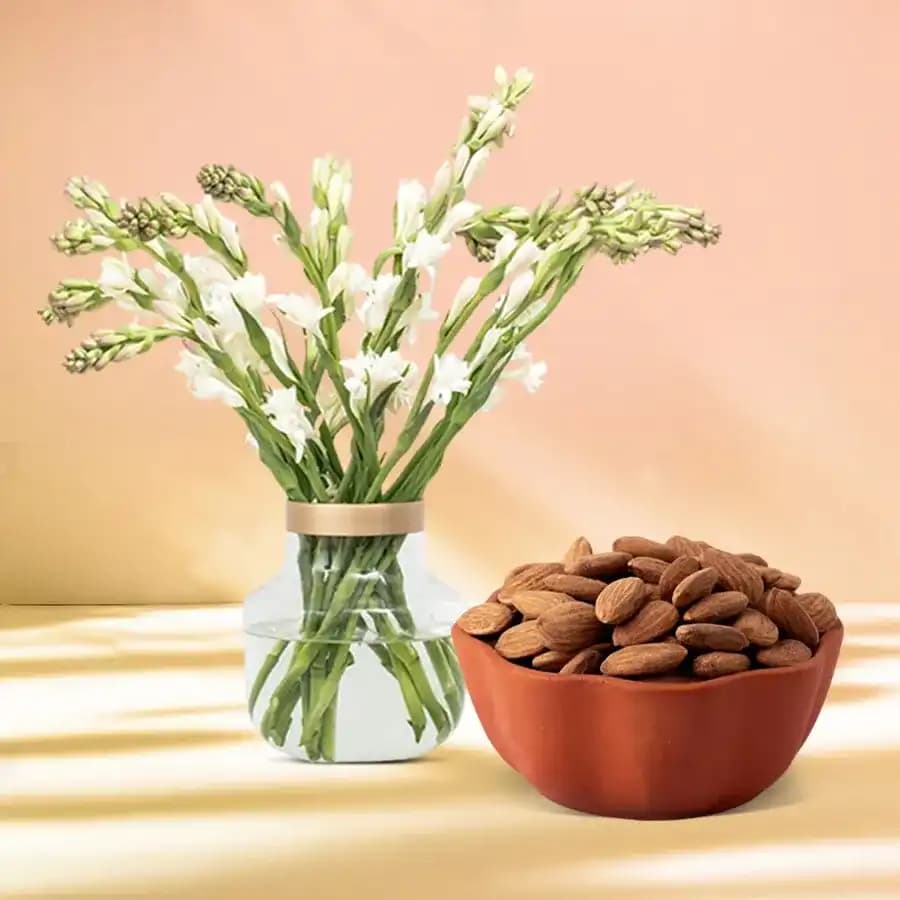 Royal Almond Treat from Shree Mithai with Rajnigandha Stems in a Glass Vase