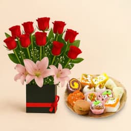 Assorted Sweets from Adyar Ananda Bhawan with a Designer Flower Arrangement 1