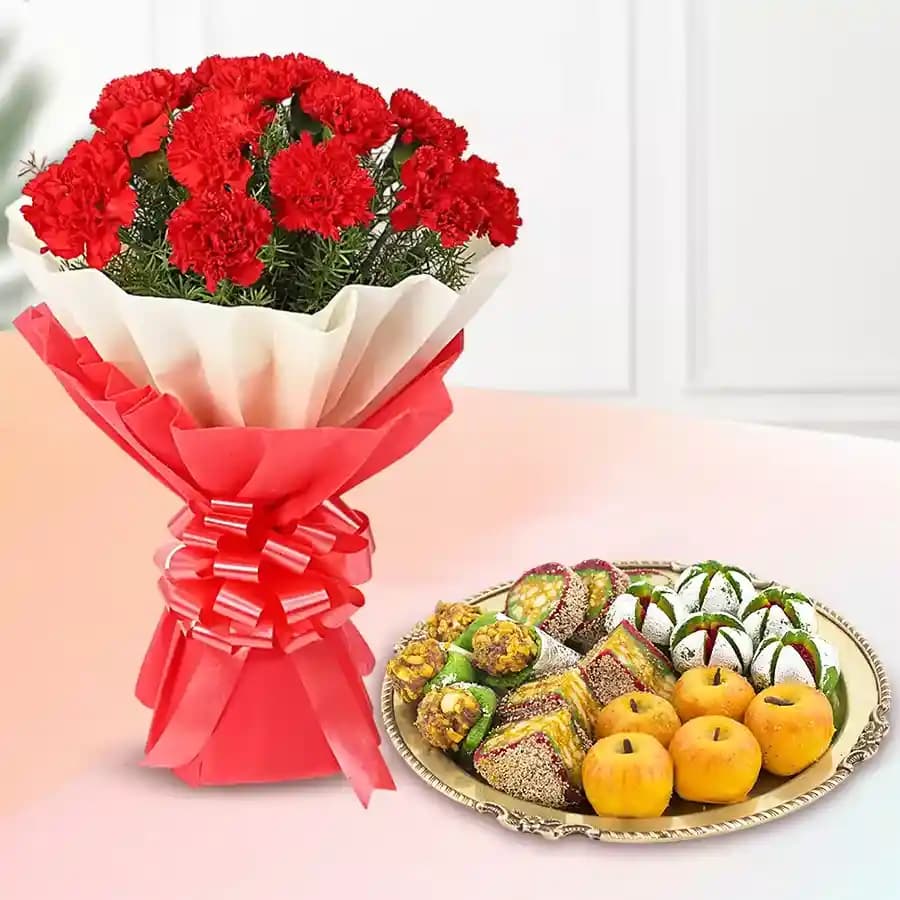 Assorted Dry Fruit Sweets from Adyar Ananda Bhawan with Red Carnation Tissue Wrapped Bouquet