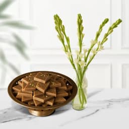 Karupatti Katli from Sri Krishna Sweets with a Rajnigandha Stems in a Glass Vase 1