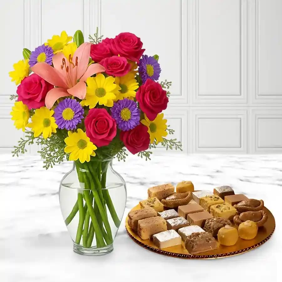 Assorted Sweets from G Pulla Reddy with Mixed Flower Arrangement