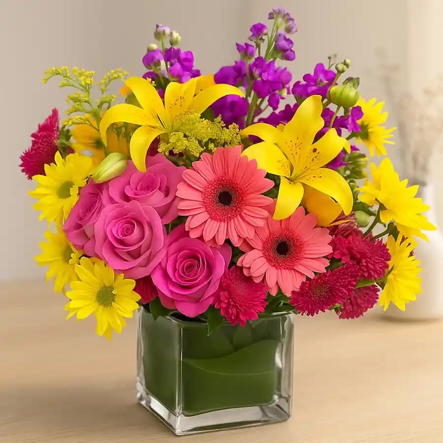 Exquisite Assorted Seasonal Flowers in a Glass Vase
