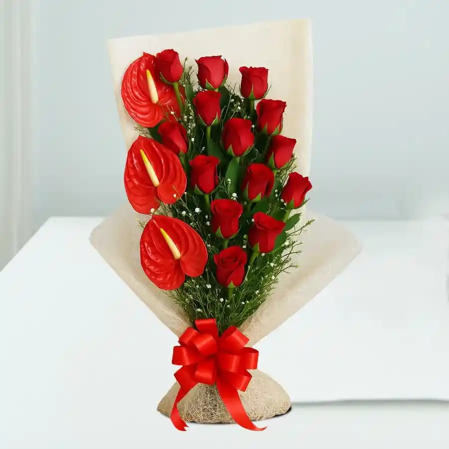 Amusing Red Roses N Anthurium Bouquet Wrapped in Tissue