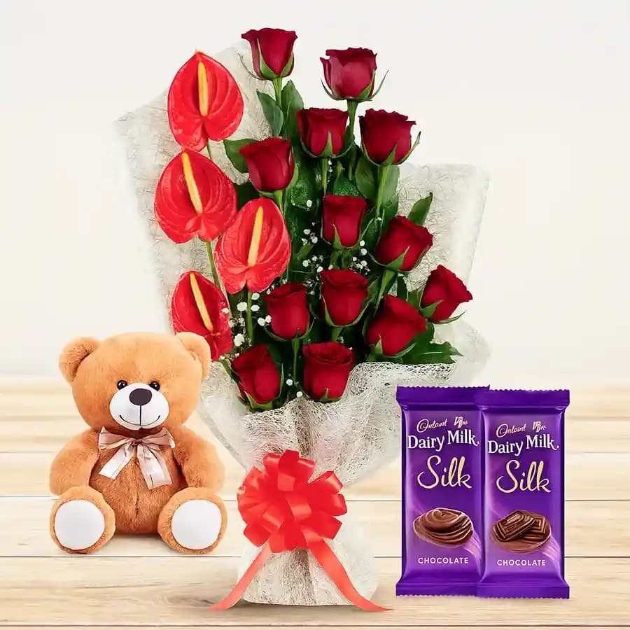 Mesmerizing Gift of Red Flowers Bouquet with Cute Teddy n Chocolates