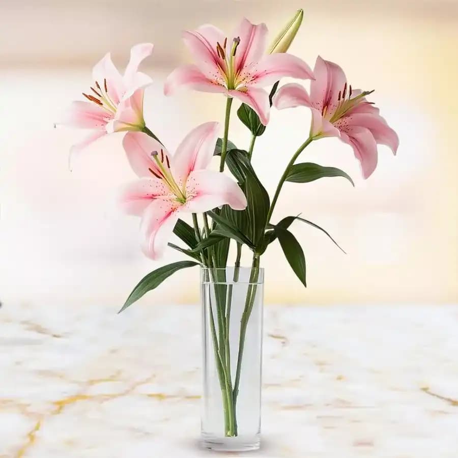Attractive display of Pink Lilies in Glass Vase
