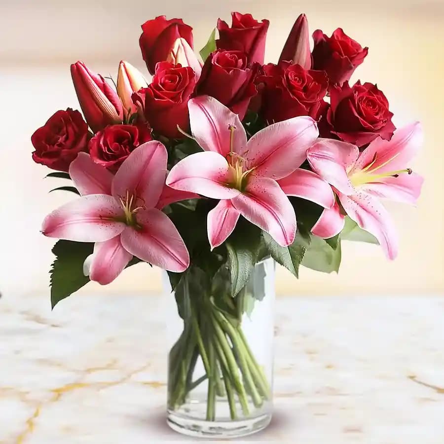 Attractive Lilies with Roses in a Glass Vase