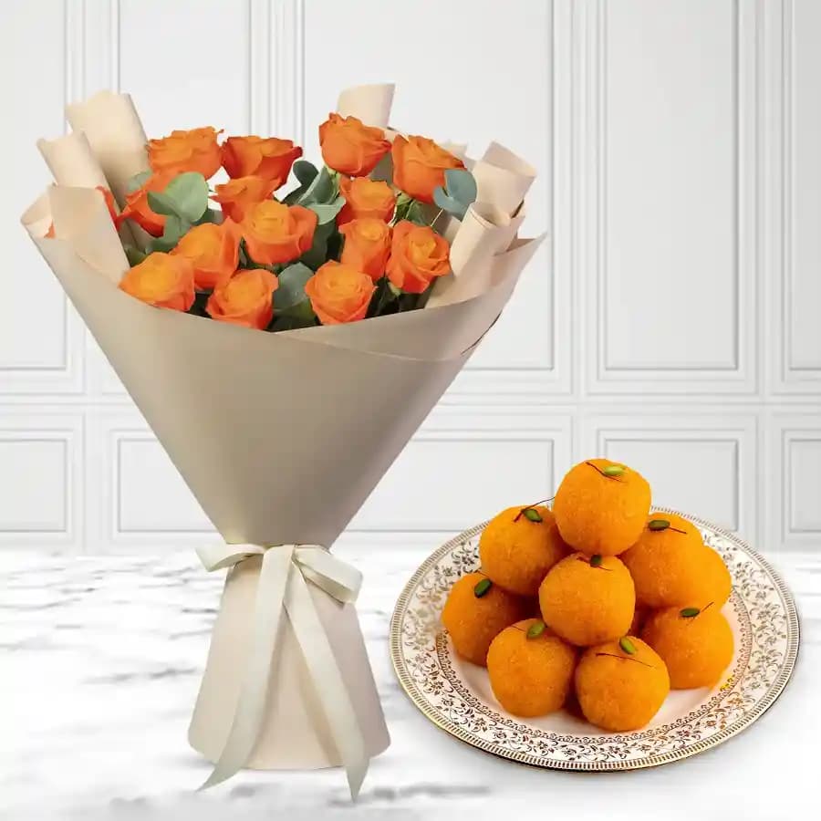 Orange Roses N Golden Laddus