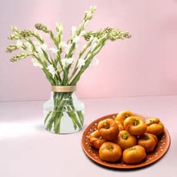 Balushahi from Karachi Sweet Mart with Rajnigandha Stems in Glass Vase 1