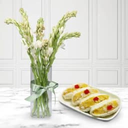 Cham Cham from Karachi Sweet Mart with Rajnigandha Stems in Glass Vase 1