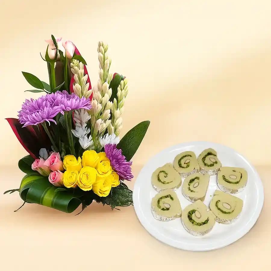Kaju Cake from Mithas Delicious Sweets with a Mixed Flower Arrangement