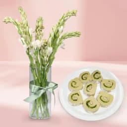 Kaju Cake from Mithas Delicious Sweets with Rajanigandha Stems in Glass Vase 1