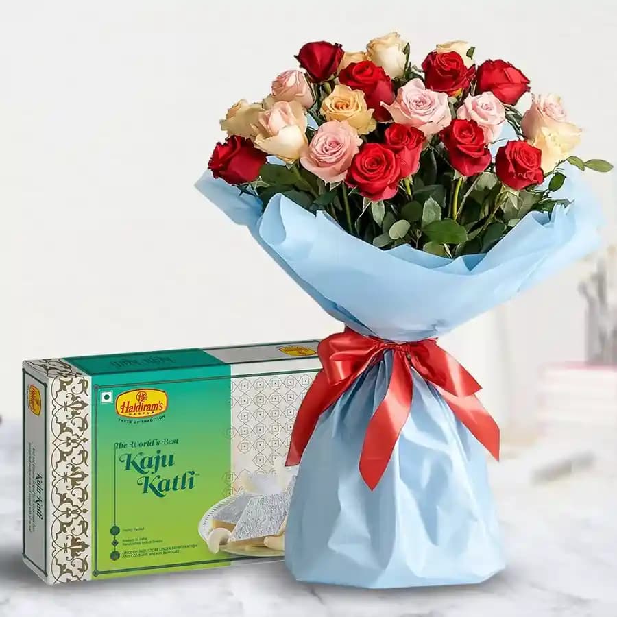 Charming assorted Roses with delicious Kaju Barfi delight