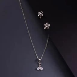 Charming Bow Charm: Silver Pendant & Earring Ensemble 1
