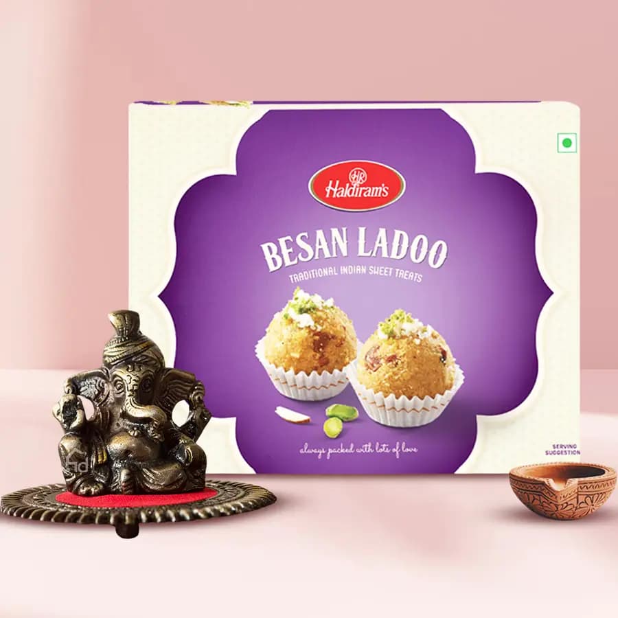 Classy Metallic Pagdi Lord Ganesha on Round Base with Sweets N Free Diya