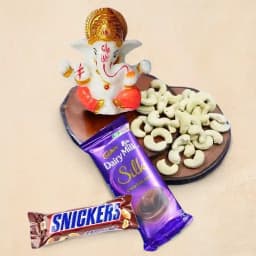 Exquisite Marble Ganesha Sculpture with Gourmet Treats 1