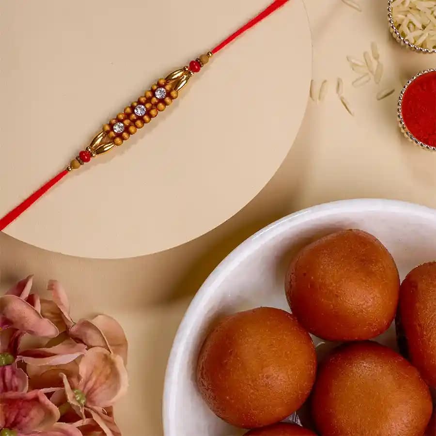 Stunning AD Rakhi N Gulab Jamun Treat